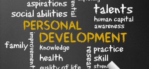 Dark chalkboard with a Personal Development illustration.
